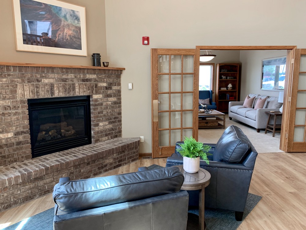 A fireplace and seating area at Autumn Springs.